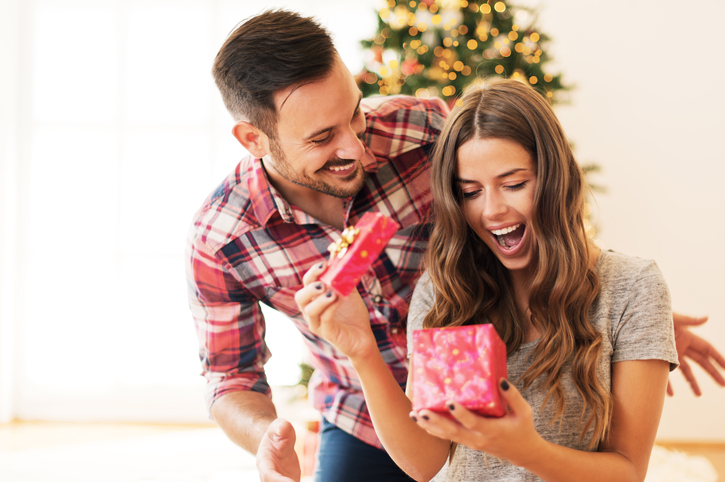 Man gives woman a Christmas present