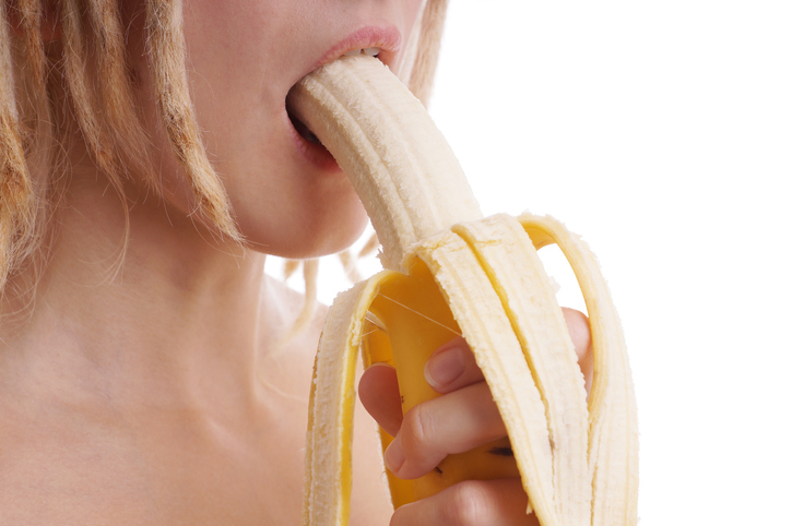 woman eating banana like oral sex
