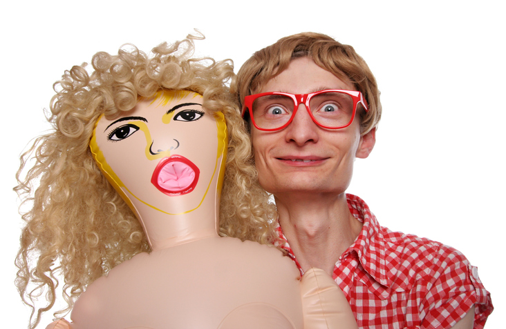 A man with an old fashioned blow up doll
